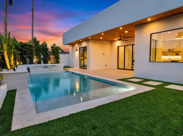 Pool and covered patio at twilight
